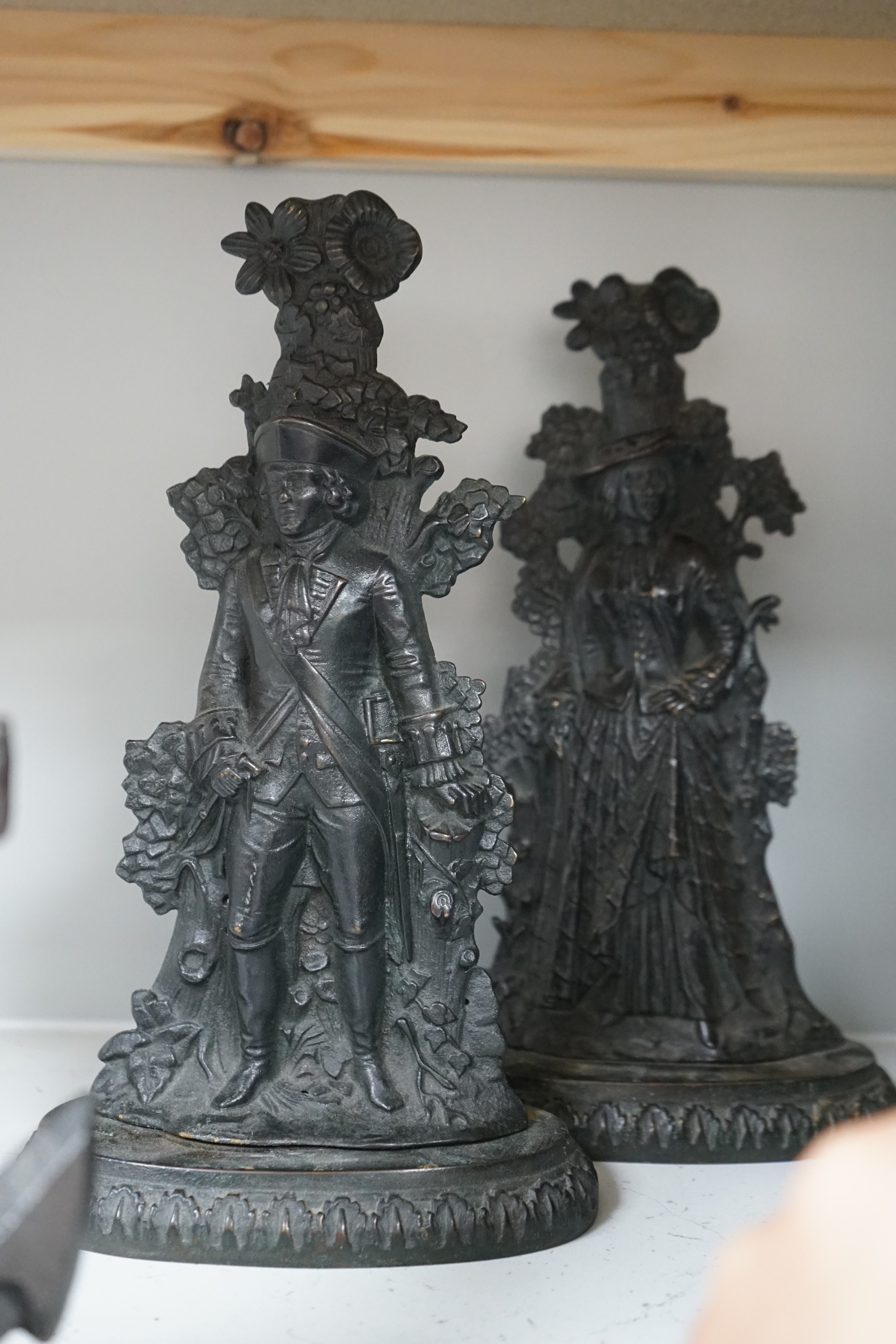 Six assorted cast iron Victorian door stops, to include a sunken anchor, one painted later, tallest 27cm
